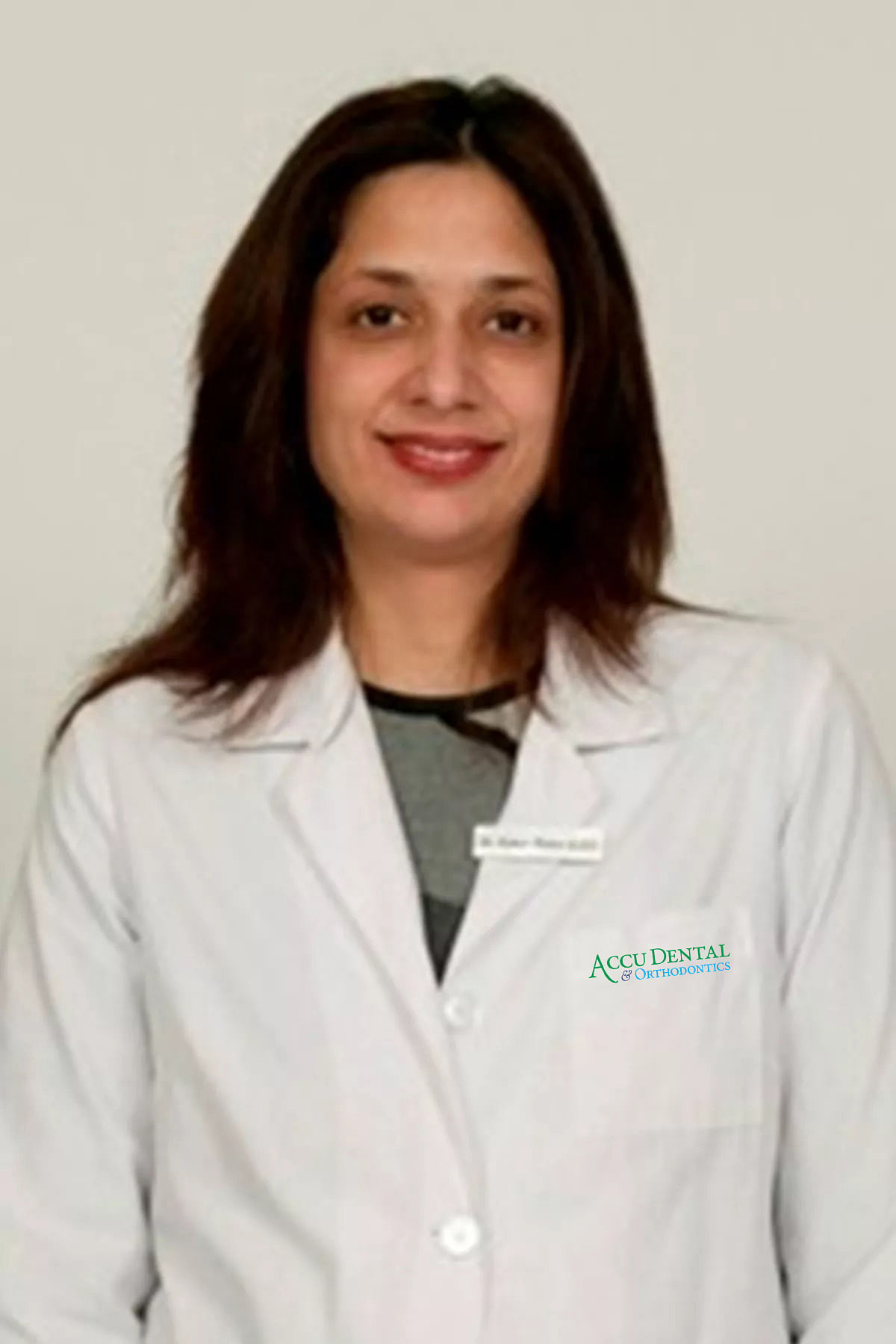 Dr. Suman Ramakumar DDS, FICOI(Dr. Kumar)